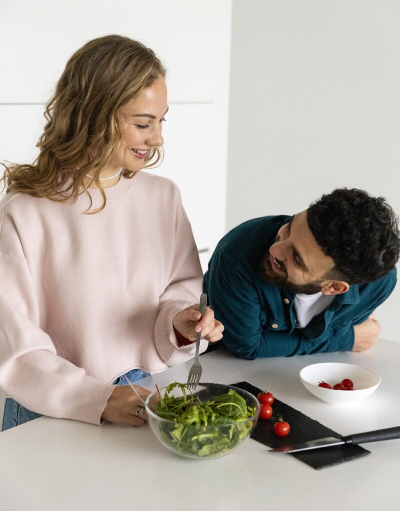 young-couple-cooking-home-together